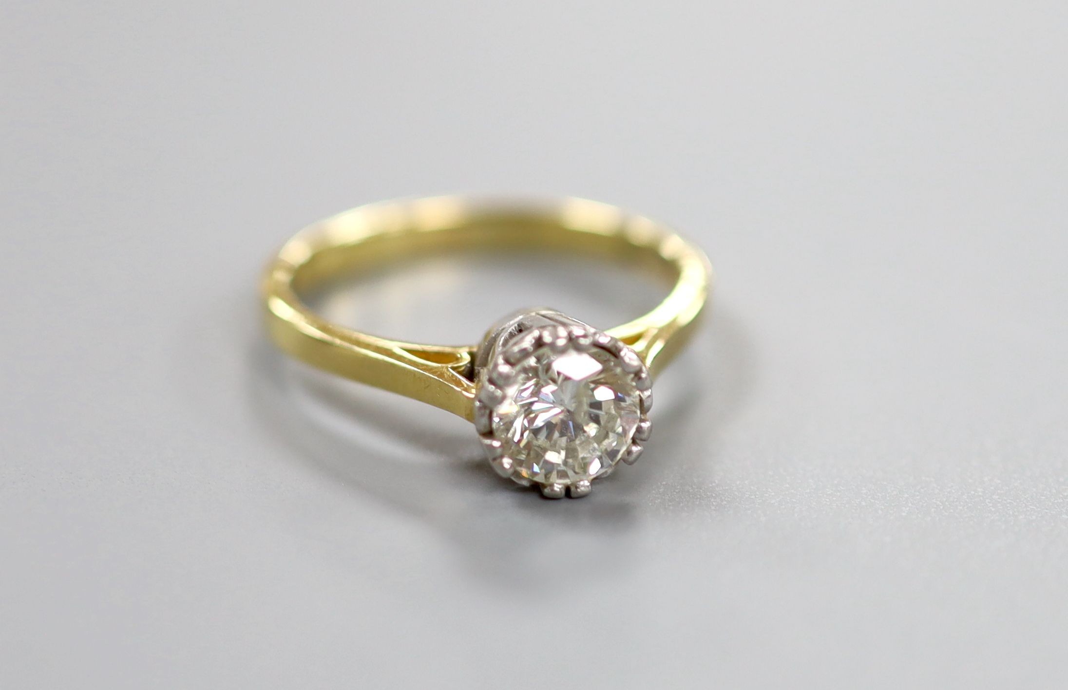 A modern 18ct gold and solitaire diamond ring, the stone weighing approx. 1.03ct, size O, gross weight 4.3 grams.